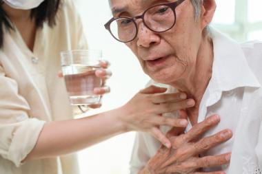 Patient struggling to swallow water 